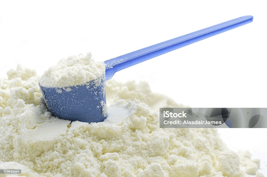 Scoop of dairy whitener powder